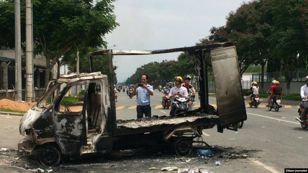 Scene after angry mobs burn, loot scores of foreign-owned factories, Binh Duong province, Vietnam, May 14, 2014.