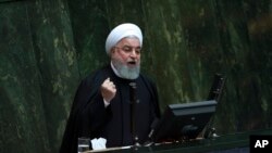 FILE - Iranian President Hassan Rouhani speaks as he submits next year's budget bill to parliament in Tehran, Iran, Tuesday, Dec. 25, 2018. 
