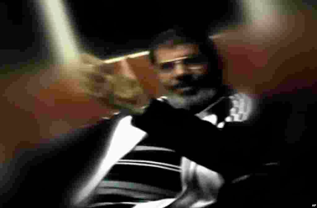 This image made from undated video posted on the website of the el-Watan newspaper on Sunday, Nov. 3, 2013, shows ousted President Mohammed Morsi during his detention at an undisclosed facility in Egypt following his ouster.