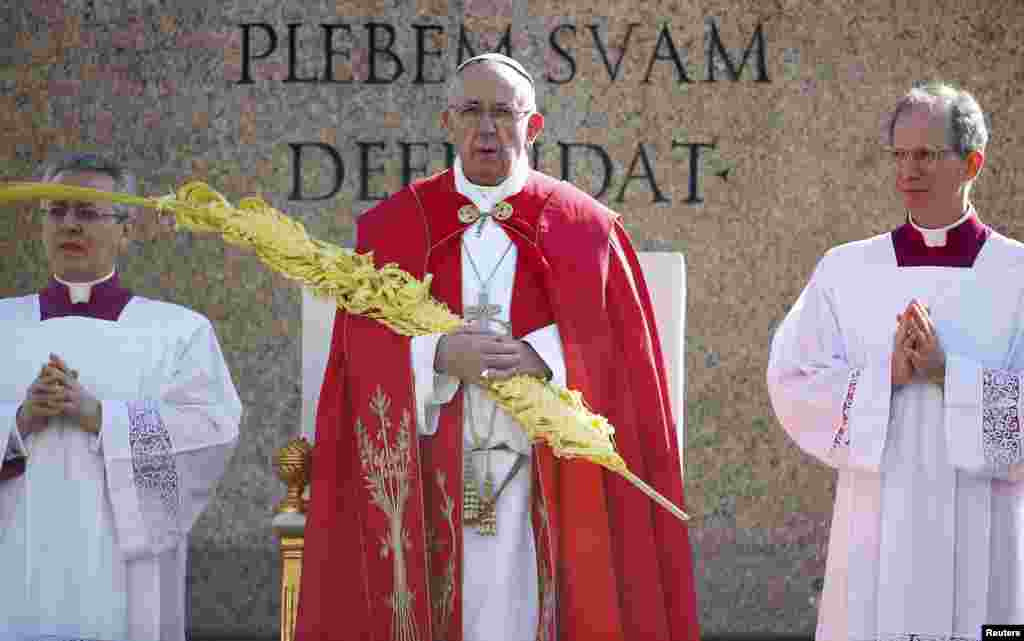 Pope Francis leads the Palm Sunday Mass at Saint Peter's Square at the Vatican.