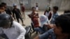 Families Want ‘Justice’ for Slain Workers 