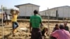 People work inside a camp set up by Myanmar's Social Welfare, Relief and Resettlement Minister to prepare for the repatriation of displaced Rohingyas, who fled to Bangladesh, outside Maungdaw in the state of Rakhine, Myanmar, Jan. 24, 2018.