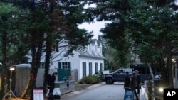 FILE - The access road to President Joe Biden's home in Wilmington, Delaware, as seen from the media van on Jan. 13, 2023. 