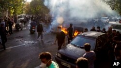 FILE - In this photo taken by an individual not employed by the Associated Press and obtained by the AP outside Iran, Iranians protests the death of 22-year-old Mahsa Amini, Tehran, Oct. 27, 2022. 
