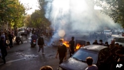 FILE - In this photo taken by an individual not employed by the Associated Press and obtained by the AP outside Iran, Iranians protests the death of 22-year-old Mahsa Amini, Tehran, Oct. 27, 2022. 