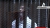 Ousted Egyptian President Defiant at Trial, General Assassinated