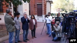 Taghi Rahmani (3rd L), husband of 2023 Nobel Peace Prize winner Narges Mohammadi, speaks with reporters in Paris on October 6, 2023. (Photo by Thomas SAMSON / AFP)