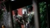 Wapiganaji wa kundi la waasi la M23 wakiwa katika mji wa Goma, mashariki mwa Jamhuri ya kidemokrasia ya Congo