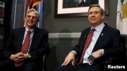 U.S. Senator Mark Kirk, an Illinois Republican, meets with President Barack Obama's Supreme Court nominee Merrick Garland, at left, on Capitol Hill in Washington, March 29, 2016.