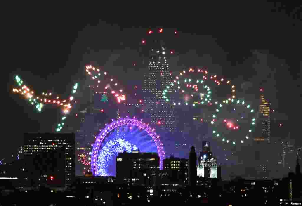 Fireworks light up the sky around the London Eye wheel to welcome the New Year in London, Britain, Jan. 1, 2019.