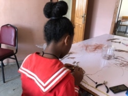 Women rescued from prostitution make jewelry from bullet casings at Ethiopian social enterprise Ellilta Products in Addis Ababa, Oct. 22, 2019.