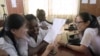 FILE - Chinese language teachers talk to a Nigerian student at the Confucius Institute at the University of Lagos, April 6, 2016. Confucius Institutes in the United States are rebranding and reopening, according to a report by the National Association of Scholars.