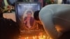 FILE - Journalists pay their last respects to colleague Martinez Zogo, who was found dead after being abducted, in Yaounde, Cameroon, Jan. 23, 2023.