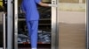 FILE - Corpses are seen at a hospital’s bereavement room, as COVID-19 cases surge in Hong Kong, China, March 3, 2022.