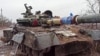 This screen grab from a handout video released by the Russian Defense Ministry on March 4, 2022, shows a destroyed Ukrainian army tank in the settlement of Gnutovo outside Mariupol.