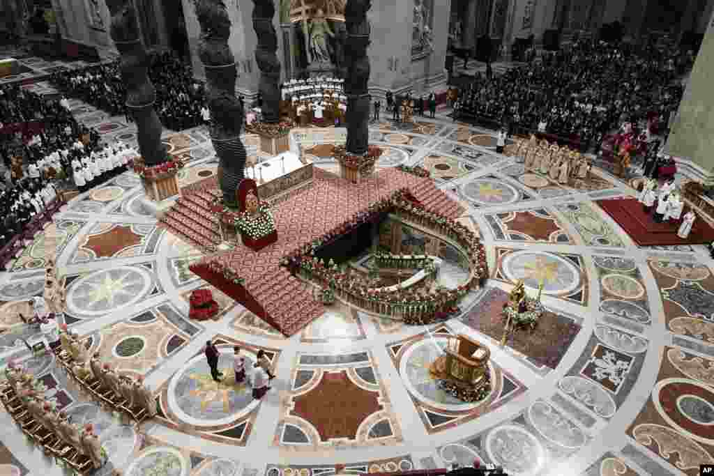 Pope Francis presides over Christmas Eve Mass in St. Peter's Basilica at the Vatican, Dec. 24, 2022.