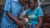 FILE - A baby is given a shot on the first day of the malaria vaccine implementation pilot program, at Mitundu Community hospital in Malawi's capital district of Lilongwe, April 23, 2019.
