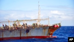 FILE - The Chinese squid fishing vessel Fu Yuan Yu 7880 sails on the Pacific Ocean on July 18, 2021. 