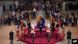 Clockwise, Prince William, Peter Phillips, James, Viscount Severn, Princess Eugenie, Prince Harry, obscured, Princess Beatrice, Lady Louise Windsor and Zara Tindall, London, Sept. 17, 2022.