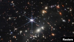 The first full-color image released by NASA from the James Webb Space Telescope shows the galaxy cluster SMACS 0723, in a composite made from images at different wavelengths taken with a Near-Infrared Camera and released July 11, 2022. (Image Credit: NAS