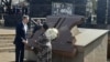 Secretary of State Antony Blinken, left, speaks with Antoinette Sithole, the sister of the late Hector Pieterson after they laid a wreath at the Hector Pieterson Memorial in Soweto, South Africa, Aug. 7, 2022. (Kate Bartlett/VOA)
