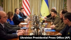 Ukrainian President Volodymyr Zelenskyy, third from right, and U.S. Speaker of the House Nancy Pelosi, third from left, talk during their meeting in Kyiv, Ukraine, April 30, 2022. 