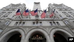 FILE - The front facade of Trump International Hotel at 1100 Pennsylvania Ave. NW, is seen in Washington, D.C., Dec. 21, 2016. Owners of a wine bar in the U.S. capital claim the hotel is unfairly hurting their business.