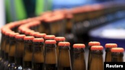 Beer bottles are pictured at the processing line of the newly inaugurated Dashen brewery plant in Debre Birhan town northeast of Ethiopia's capital Addis Ababa Nov. 15, 2015.