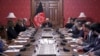FILE - In this photo released by the Afghan Presidential Palace, Afghan President Ashraf Ghani, center, speaks to U.S. peace envoy Zalmay Khalilzad, third left, at the presidential palace in Kabul, Afghanistan, Jan. 28, 2019. 