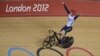 Britain's Jason Kenny celebrates after winning the gold medal in the track cycling men's sprint event, during the 2012 Summer Olympics in London, Monday, Aug. 6, 2012.