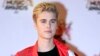 FILE - Justin Bieber arrives at the Cannes festival palace in Cannes, southeastern France, Nov. 7, 2015. 