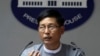 FILE - Myanmar government spokesman Zaw Htay talks to journalists during a news briefing at the Presidential Palace in Naypyitaw, Myanmar, Sept 13, 2017.