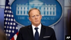 White House press secretary Sean Spicer, who resigned his post Friday, listens to a reporter's question during a briefing at the White House, June 20, 2017 in Washington. 