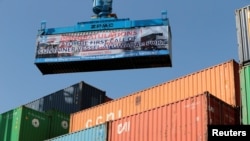 FILE - A container ship prepare to leave the China Pakistan Economic Corridor port in Gwadar, Pakistan, Nov. 13, 2016. Chinese investments in commercial ports around the world could pave the way for China to expand its military footprint, said an analyst in January 2023.