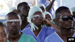 FILE - Medics attend specialized training in an Ebola treatment unit in Freetown, Sierra Leone, Dec. 19, 2014.