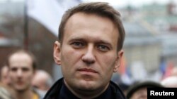 Russian opposition leader Alexei Navalny walks during an opposition rally in Moscow, Oct. 27, 2013.