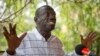 Opposition leader and presidential candidate Kizza Besigye speaks to the media while under continued house arrest, at his home in Kasangati, outside the capital Kampala, in Uganda, Feb. 21, 2016. 