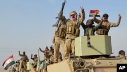 Iraqi security forces deploy in Rawah, northwest of Baghdad, Iraq, Nov. 17, 2017. Iraqi forces backed by the U.S.-led coalition retook the last town in the country that was held by the Islamic State group.