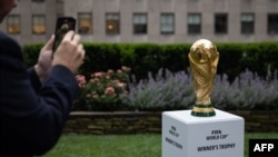 FILE - The FIFA World Cup trophy is displayed during an event in New York after an announcement related to the staging of the FIFA World Cup 2026, on June 16, 2022.