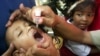 FILE - An Indonesian boy is given polio vaccine in Jakarta, Indonesia, Nov. 30, 2005.