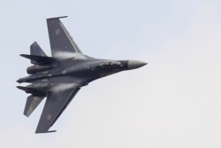 FILE - A Sukhoi Su-35 fighter with special vectored thrust jet engines takes part in a flying display at the Le Bourget airport near Paris.