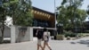 FILE - Students walk on the campus of the University of New South Wales, in Sydney, Australia, Dec 1, 2020. 