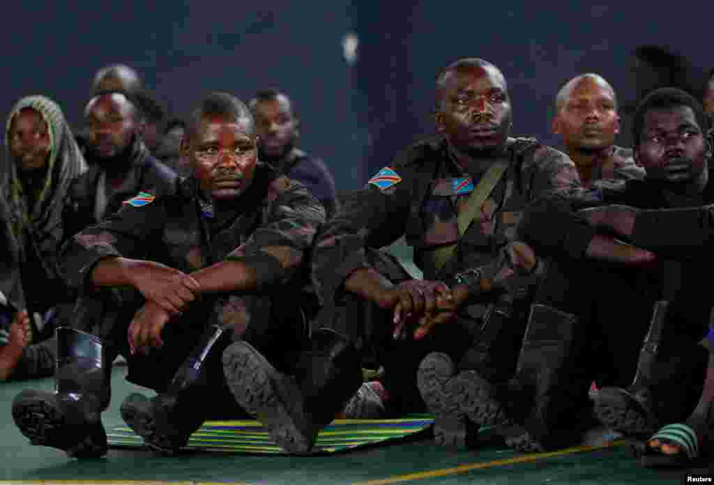 Members of the Armed Forces of the Democratic Republic of the Congo (FARDC), who surrendered from Goma, gather at the Vision Jeunesse Nouvelle Cultural Centre in Gisenyi, Rwanda, Jan. 28, 2025.