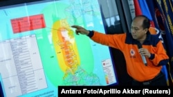 Sutopo Purwo Nugroho, a spokesman of Indonesia's disaster mitigation agency BNPB, holds a news conference to brief reporters on the latest situation after a strong quake and tsunami hit Sulawesi island, at the BNPB headquarters in Jakarta, Indonesia, Sept. 29, 2018.