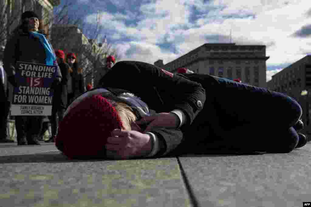 Abortion opponents participate in a "die-in" in front of the White House, Jan. 27, 2017, in Washington, D.C.