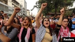 Demonstrators shout slogans during an anti-government protest in the southern city of Nabatyeh, Lebanon, Oct. 24, 2019. 