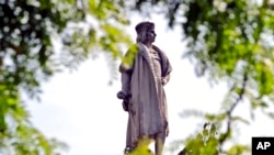 FILE - This Aug. 27, 2017, photo shows a Christopher Columbus statue in New York. Monday is Columbus Day in the U.S., a federal holiday that celebrates the Italian explorer Christopher Columbus. U.S. President Joe Biden also has proclaimed Monday as Indigenous Peoples Day.