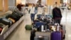 Unclaimed bags sit in baggage claim at Hartsfield-Jackson Atlanta International Airport in Atlant. Atlanta's city council has approved a far-reaching ban on smoking and vaping in restaurants, bars and inside the airport.