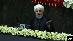 FILE - Iranian President Hassan Rouhani speaks during the inauguration of the new parliament in Tehran, Iran, May, 27, 2020. 