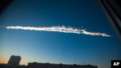 A meteorite contrail is seen over Chelyabinsk, February 15, 2013. 